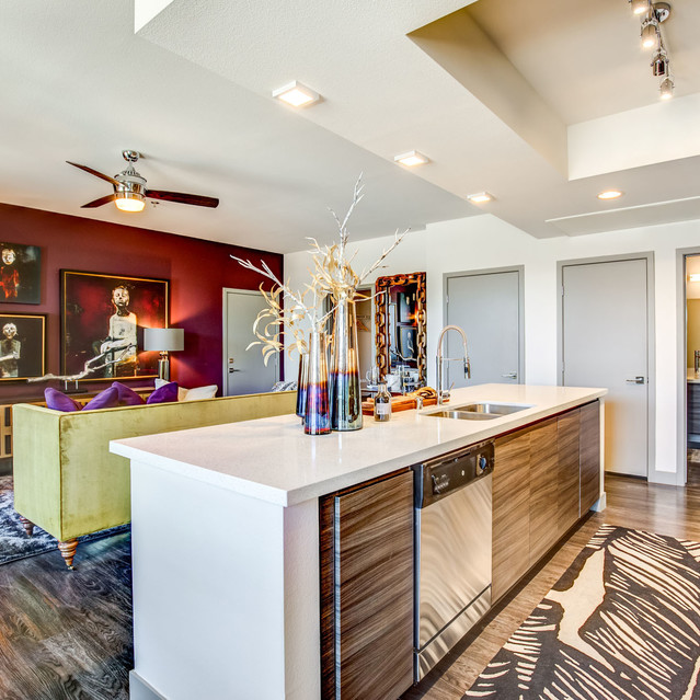 Douglas at Stonelake - Open-Concept Living Space with Bold Red Accent Wall