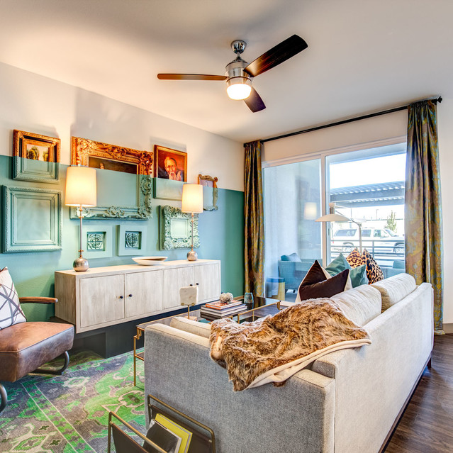 Douglas at Stonelake - Living Room with Two-Tone Wall Accent and a Ceiling Fan